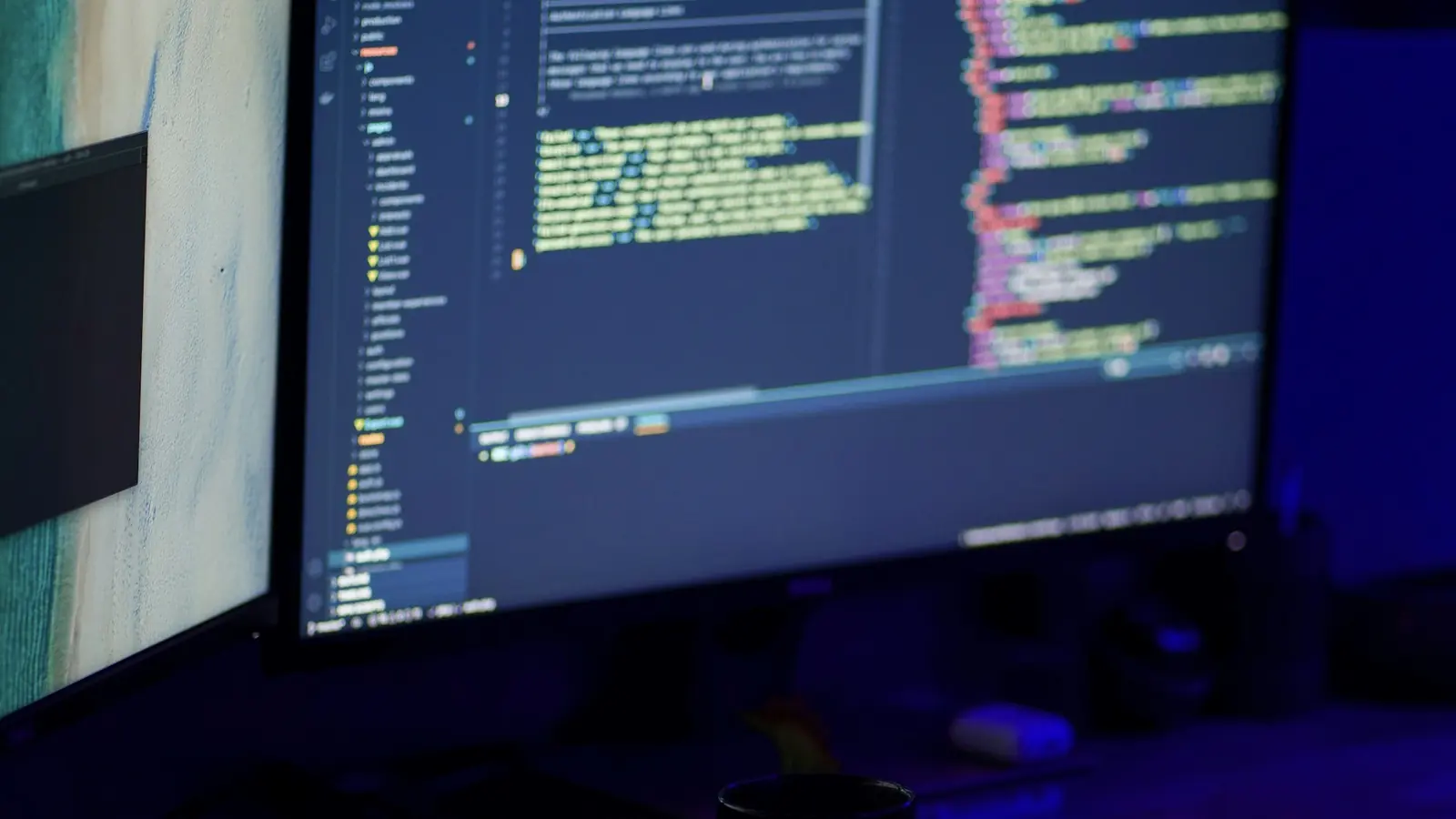 A laptop screen split into several terminal panes, each pane's tab labeled with a different project folder name.